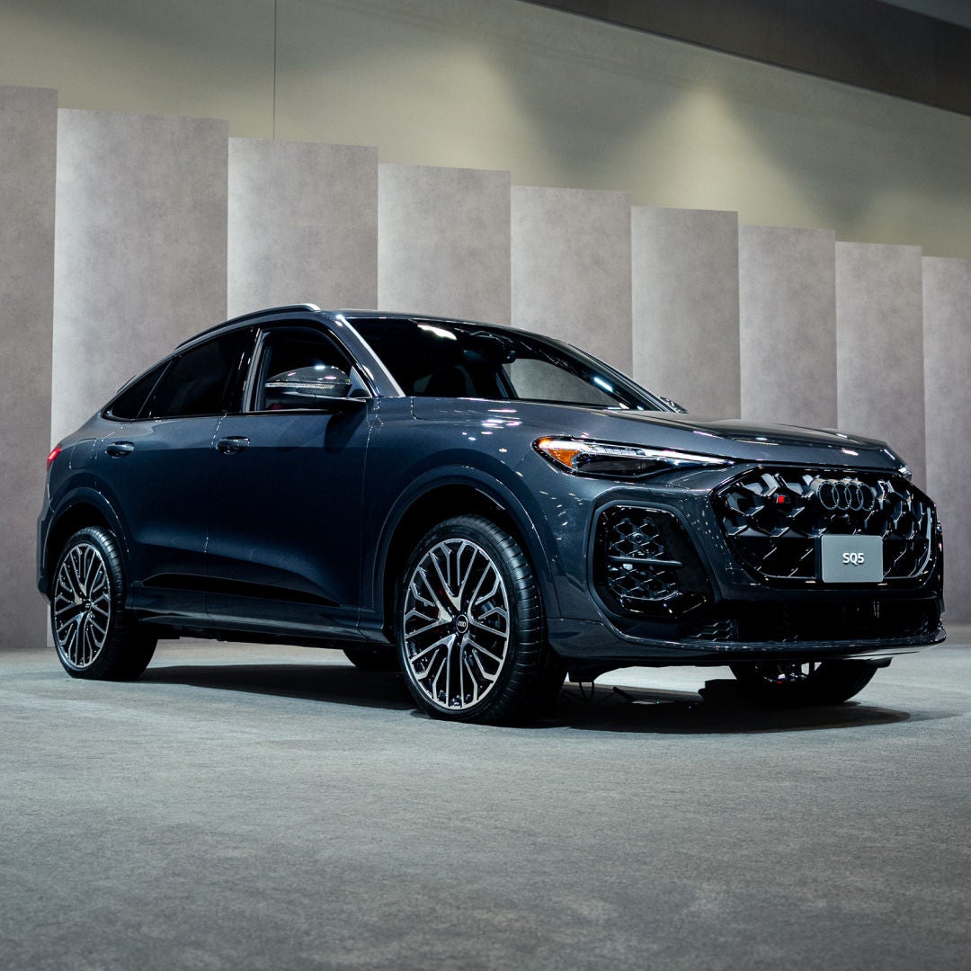 Side profile view of an Audi SUV.